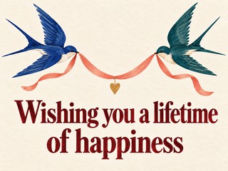Illustration of two swallows carrying a coral ribbon and golden heart, with the message “Wishing you a lifetime of happiness”