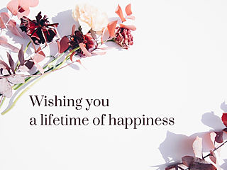 Wedding card cover with burgundy and blush flowers and the text 'Wishing you a lifetime of happiness'