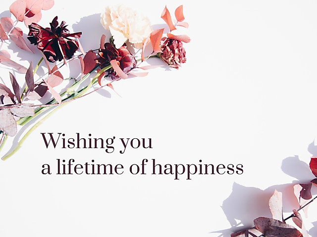 Wedding card cover with burgundy and blush flowers and the text 'Wishing you a lifetime of happiness'