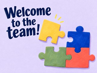 Illustration of colorful puzzle pieces on lavender, with the message “Welcome to the team!”
