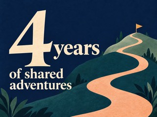 Illustration of cream lettering above a winding path through hills, with the message “4 years of shared adventures”